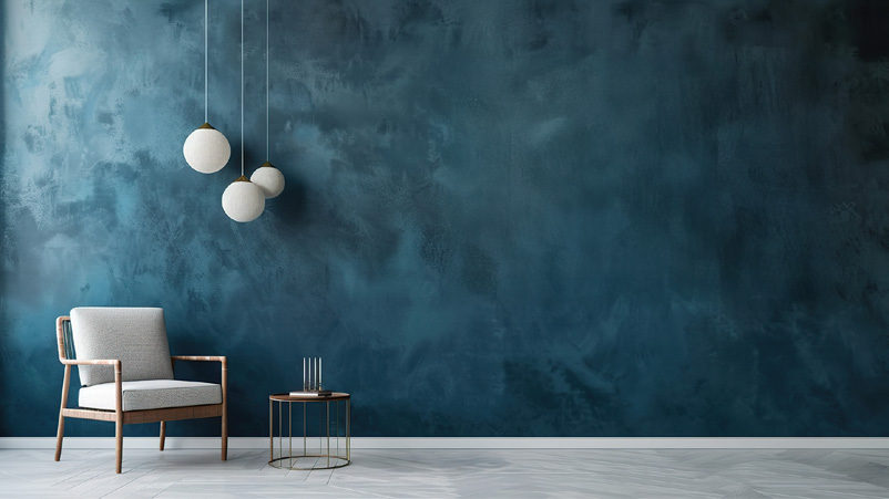 Interior with textured blue wall and pendant lighting